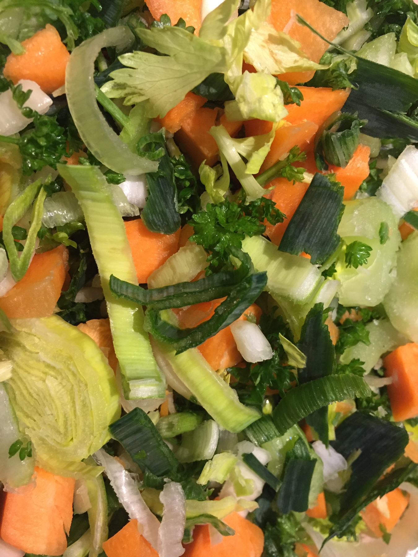 Chopped soup vegetables, carrot, celery, leek, and flat leaf parsley (including the stalks)